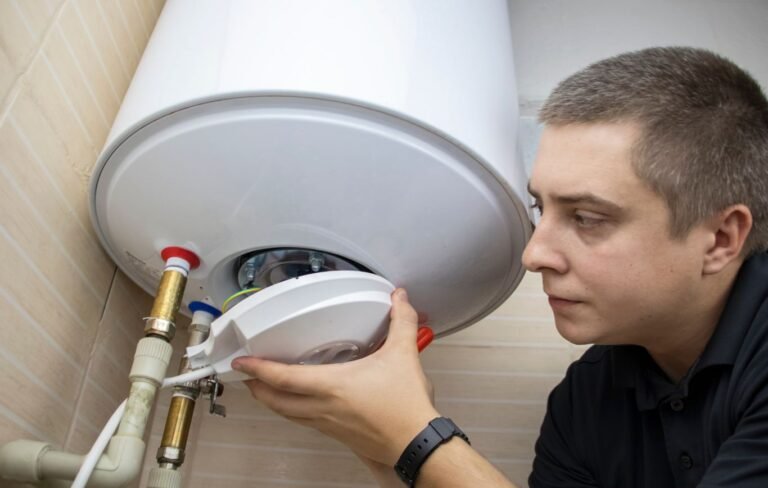 Einstein pros plumber fixing water heater