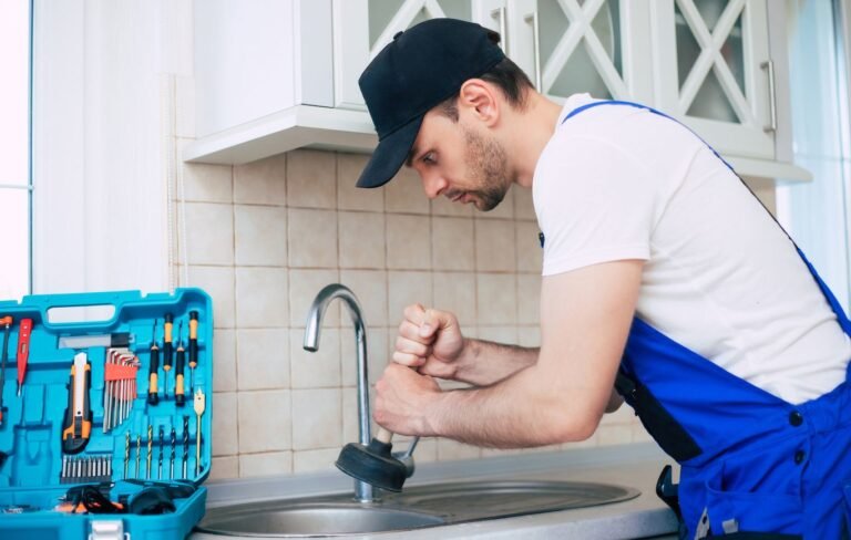 Einstein Pros plumber cleaning the drain